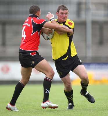 11.07.10.. South Wales Scorpions v Gateshead Thunder, The Co-operative Championship Div 1 -  Scorpions Neil Dallimore takes on Gateshead's Michael Brown  