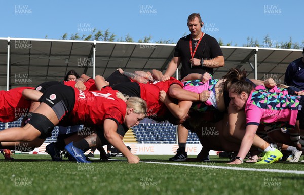 200923 - Scotland Women and Wales Women Combined Training Session - Ioan Cunningham looks on as the Welsh and Scottish packs scrummage against each other during a combined training session in Edinburgh
