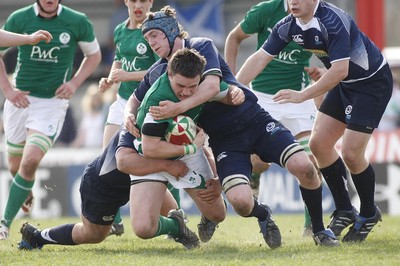 10.04.10 Scotland U18 v Ireland U18 - Under 18s 5 Nations Festival -  Ireland's James Rael is brought to ground by Scotland's Robin Hislop(L) & Lawrie Seydak. 