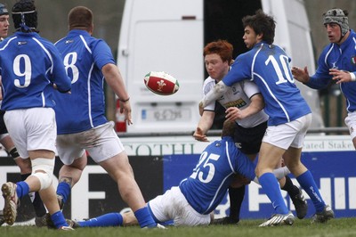 06.04.10 Scotland U18 v Italy U18 - Under 18s 5 Nations Festival -  Scotland's Murray McConnell offloads out the tackles of Italy's Peter Pavanelio(25) & Andrea Menniti. 