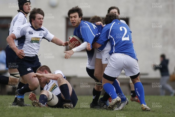 06.04.10 Scotland U18 v Italy U18 - Under 18s 5 Nations Festival -  Italy's Andrea Menniti tries to keep the ball alive as he is wrapped up by aggressive Scottish defense. 