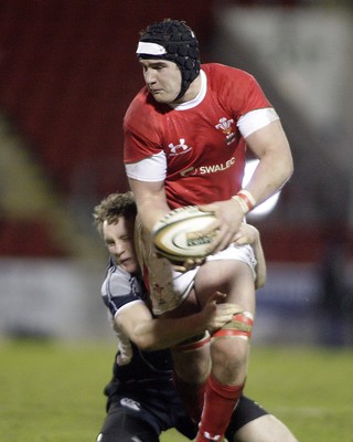 06.02.09 - Scotland U20 v Wales U20... Andrew White of Scotland tackles James Thomas of Wales.  
