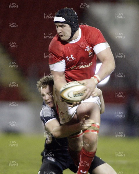 06.02.09 - Scotland U20 v Wales U20... Andrew White of Scotland tackles James Thomas of Wales.  