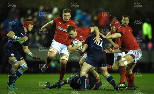 080319 - Scotland Under 20 v Wales Under 20 - U20s 6 Nations Championship - Dewi Lake of Wales is tackled by Charlie Jupp and Robbie McCallum of Scotland