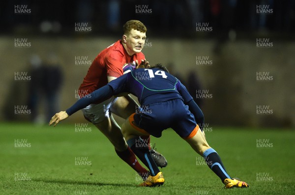080319 - Scotland Under 20 v Wales Under 20 - U20s 6 Nations Championship - Aneurin Owen of Wales is tackled by Rory McMichael of Scotland
