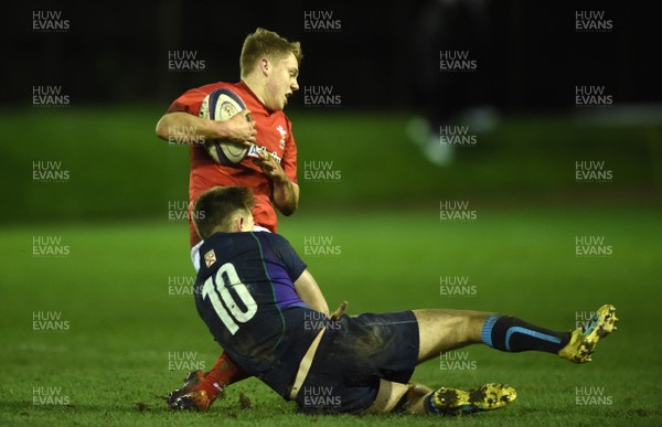 080319 - Scotland Under 20 v Wales Under 20 - U20s 6 Nations Championship - Sam Costelow of Wales is tackled by Jack Mann of Scotland