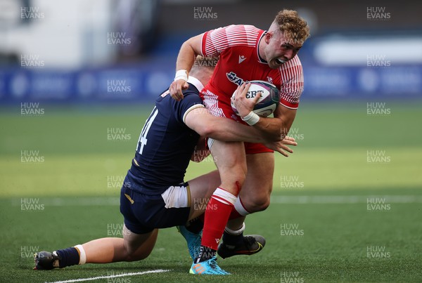 130721 - Wales U20s v Scotland U20s - Morgan Richards of Wales is tackled by Finlay Callaghan of Scotland