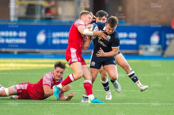 130721 - Wales U20 v Scotland U20 - Under 20 Six Nations  -  Michael Gray of Scotland is tackled and stripped of the ball by Sam Costelow of Wales