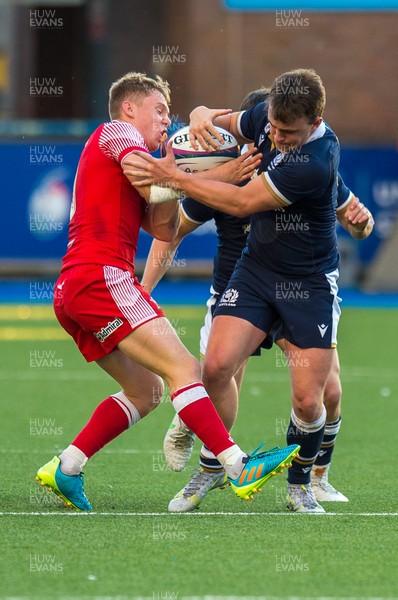 130721 - Wales U20 v Scotland U20 - Under 20 Six Nations  -  Michael Gray of Scotland is tackled and stripped of the ball by Sam Costelow of Wales