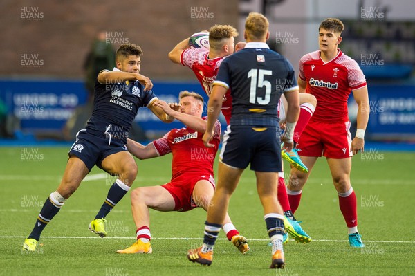 130721 - Wales U20 v Scotland U20 - Under 20 Six Nations  - Ollie Meville of Scotland competes with Morgan Richards of Wales and Carrick McDonough of Wales for the high ball
