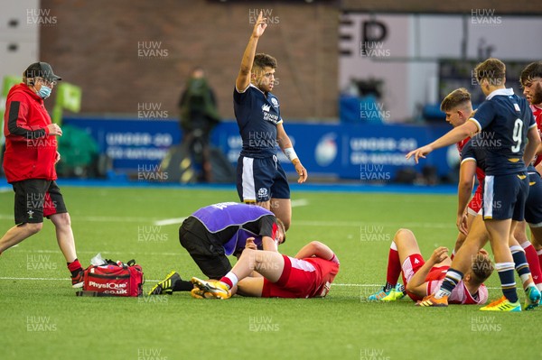 130721 - Wales U20 v Scotland U20 - Under 20 Six Nations  - Ollie Meville of Scotland calls the referees attention to an injury to Carrick McDonough of Wales