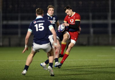 070325 - Scotland U20s v Wales U20s - U20s 6 Nations Championship - Elijah Evans of Wales is tackled by Fergus Watson of Scotland 