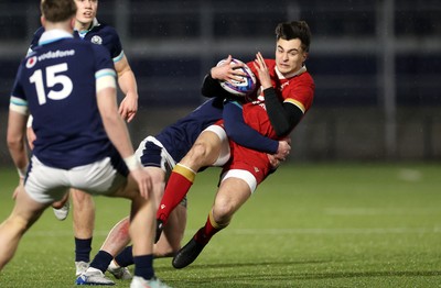 070325 - Scotland U20s v Wales U20s - U20s 6 Nations Championship - Elijah Evans of Wales is tackled by Fergus Watson of Scotland 