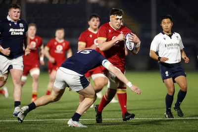 070325 - Scotland U20s v Wales U20s - U20s 6 Nations Championship - Kenzie Jenkins of Wales is tackled by Jack Brown of Scotland 