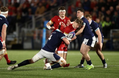 070325 - Scotland U20s v Wales U20s - U20s 6 Nations Championship - Harri Ford of Wales is tackled by Charlie Moss of Scotland 