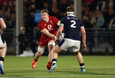 070325 - Scotland U20s v Wales U20s - U20s 6 Nations Championship - Harry Beddall of Wales is challenged by Joe Roberts of Scotland 