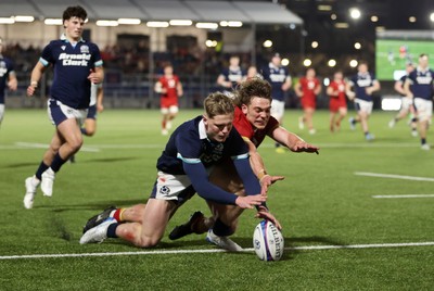 070325 - Scotland U20s v Wales U20s - U20s 6 Nations Championship - Fergus Watson of Scotland and Aidan Boshoff of Wales dive for the ball