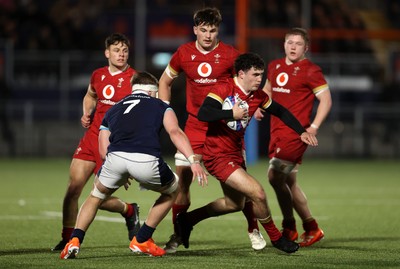 070325 - Scotland U20s v Wales U20s - U20s 6 Nations Championship - Harri Wilde of Wales is challenged by Freddy Douglas of Scotland 