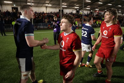 070325 - Scotland U20s v Wales U20s - U20s 6 Nations Championship - Tom Bowen of Wales shakes hands with opposition team at full time