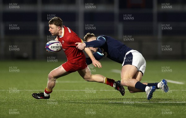 070325 - Scotland U20s v Wales U20s - U20s 6 Nations Championship - Tom Bowen of Wales is tackled by Fergus Watson of Scotland 