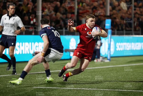 070325 - Scotland U20s v Wales U20s - U20s 6 Nations Championship - Tom Bowen of Wales is challenged by Matthew Urwin of Scotland 