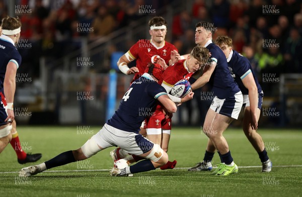 070325 - Scotland U20s v Wales U20s - U20s 6 Nations Championship - Harri Ford of Wales is tackled by Charlie Moss of Scotland 