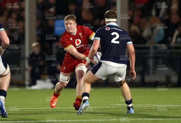 070325 - Scotland U20s v Wales U20s - U20s 6 Nations Championship - Harry Beddall of Wales is challenged by Joe Roberts of Scotland 