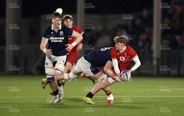 070325 - Scotland U20s v Wales U20s - U20s 6 Nations Championship - Harri Ford of Wales is tackled by Oliver Duncan of Scotland 