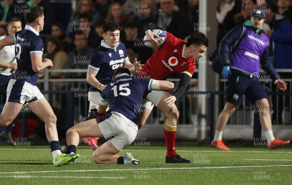 070325 - Scotland U20s v Wales U20s - U20s 6 Nations Championship - Elijah Evans of Wales is tackled by Jack Brown of Scotland 