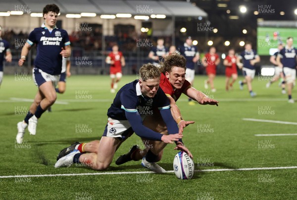 070325 - Scotland U20s v Wales U20s - U20s 6 Nations Championship - Fergus Watson of Scotland and Aidan Boshoff of Wales dive for the ball