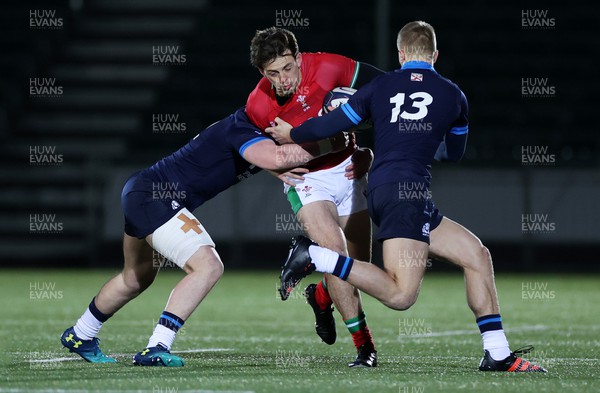 100223 - Scotland U20s v Wales U20s - U20s 6 Nations Championship - Louie Hennessey of Wales is tackled by Kerr Yule and Duncan Munn of Scotland