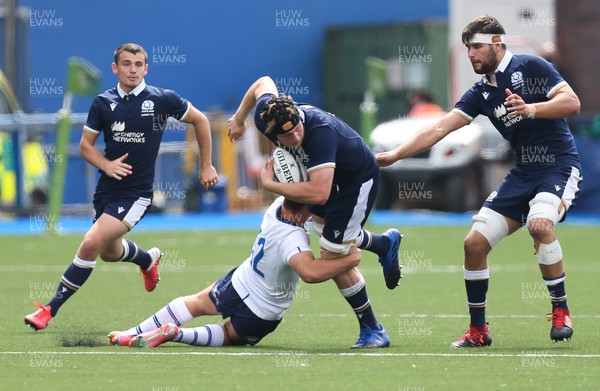 010721 - Scotland U20 v Italy U20, 2021 Six Nations U20 Championship - Max Williamson of Scotland looks for support as he is tackled by Filippo Drago of Italy