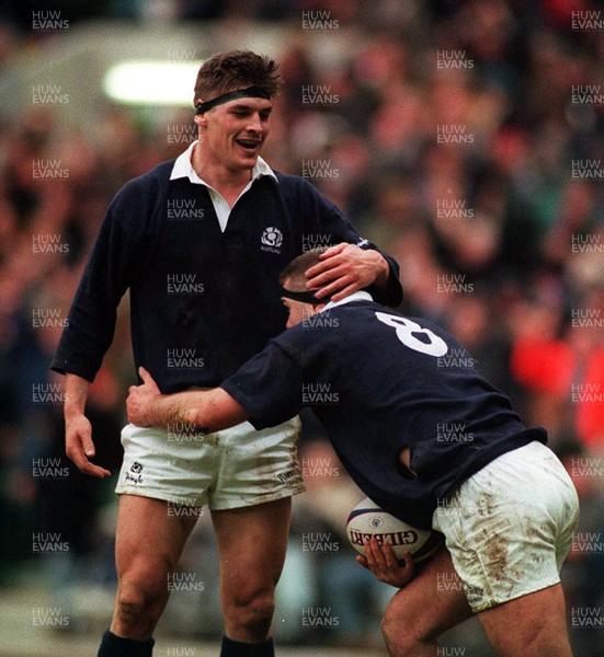 040395 - Scotland v Wales - Five Nations - Rob Wainwright congratulates Eric Peters of Scotland on his try