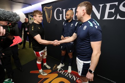 080325 - Scotland v Wales - Guinness 6 Nations Championship - Jac Morgan of Wales and Finn Russell of Scotland at the coin toss