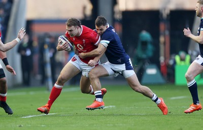 080325 - Scotland v Wales - Guinness 6 Nations Championship - Max Llewellyn of Wales is tackled by Ben White of Scotland 