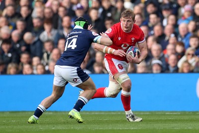 080325 - Scotland v Wales - Guinness 6 Nations Championship - Jac Morgan of Wales is tackled by Darcy Graham of Scotland 