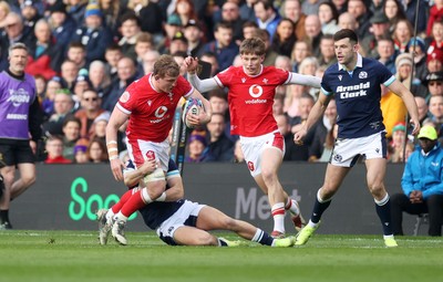 080325 - Scotland v Wales - Guinness 6 Nations Championship - Jac Morgan of Wales is tackled by Darcy Graham of Scotland 