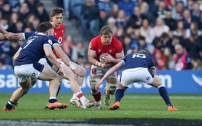 080325 - Scotland v Wales - Guinness 6 Nations Championship - Jac Morgan of Wales is tackled by Finn Russell of Scotland 