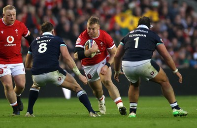 080325 - Scotland v Wales - Guinness 6 Nations Championship - Dewi Lake of Wales is challenged by Jack Dempsey of Scotland 