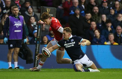 080325 - Scotland v Wales - Guinness 6 Nations Championship - Ellis Mee of Wales can�t get to the ball before Duhan van der Merwe of Scotland 