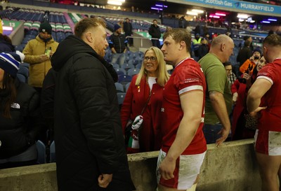 080325 - Scotland v Wales - Guinness 6 Nations Championship - Tommy Reffell and Jac Morgan of Wales with family at full time