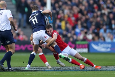 080325 - Scotland v Wales - Guinness 6 Nations Championship - Duhan van der Merwe of Scotland is tackled by Gareth Anscombe of Wales 