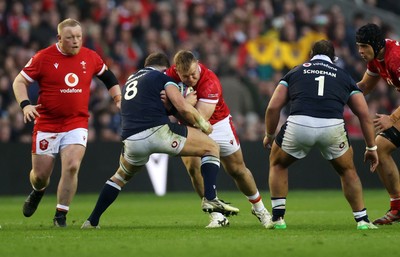 080325 - Scotland v Wales - Guinness 6 Nations Championship - Dewi Lake of Wales is tackled by Jack Dempsey of Scotland 