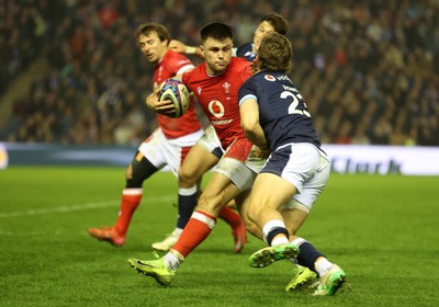 080325 - Scotland v Wales - Guinness 6 Nations Championship - Joe Roberts of Wales is tackled by Kyle Rowe of Scotland 