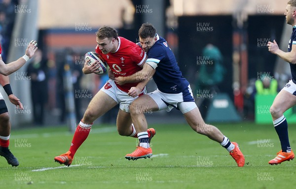 080325 - Scotland v Wales - Guinness 6 Nations Championship - Max Llewellyn of Wales is tackled by Ben White of Scotland 