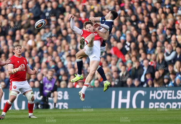 080325 - Scotland v Wales - Guinness 6 Nations Championship - Ellis Mee of Wales collides with Blair Kinghorn of Scotland in the air