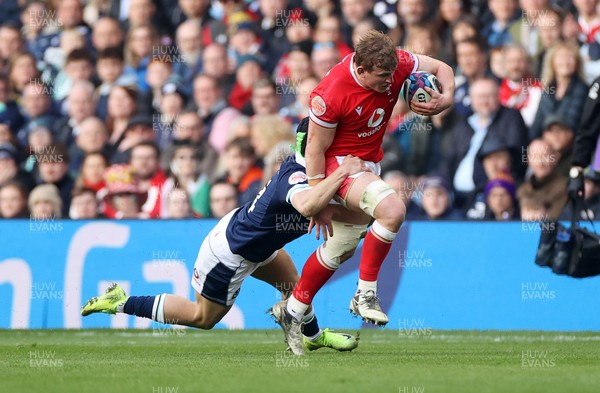 080325 - Scotland v Wales - Guinness 6 Nations Championship - Jac Morgan of Wales is tackled by Darcy Graham of Scotland 