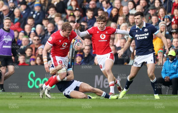 080325 - Scotland v Wales - Guinness 6 Nations Championship - Jac Morgan of Wales is tackled by Darcy Graham of Scotland 