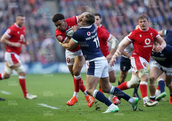 080325 - Scotland v Wales - Guinness 6 Nations Championship - Ben Thomas of Wales is tackled by Duhan van der Merwe of Scotland 