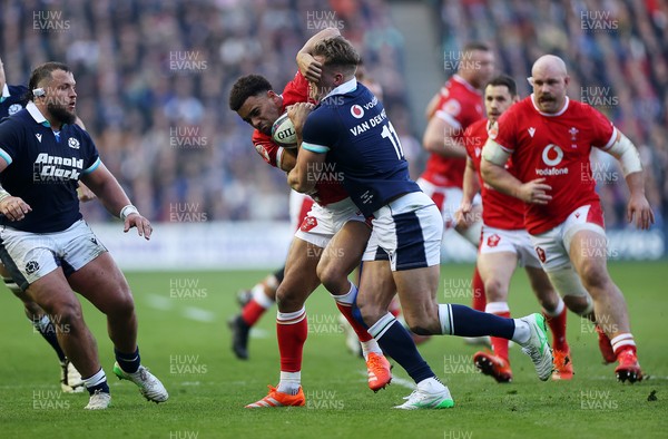 080325 - Scotland v Wales - Guinness 6 Nations Championship - Ben Thomas of Wales is tackled by Duhan van der Merwe of Scotland 